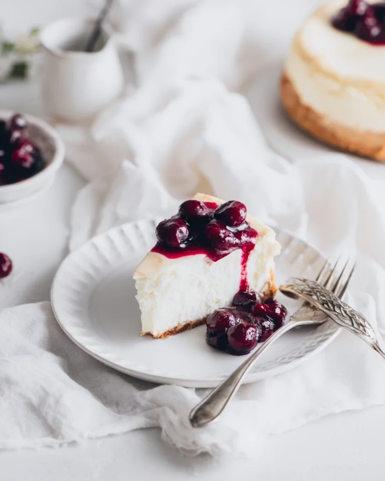 Cottage cheese cheesecake slice served with berry compote