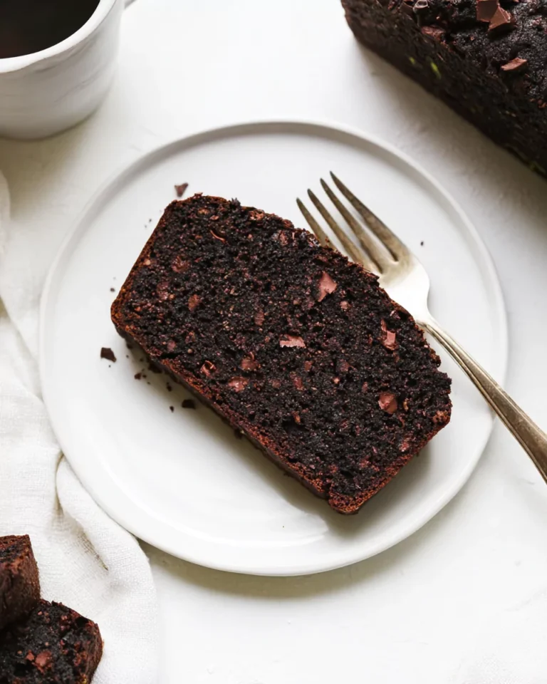 sliced gluten-free chocolate zucchini bread served with coffee