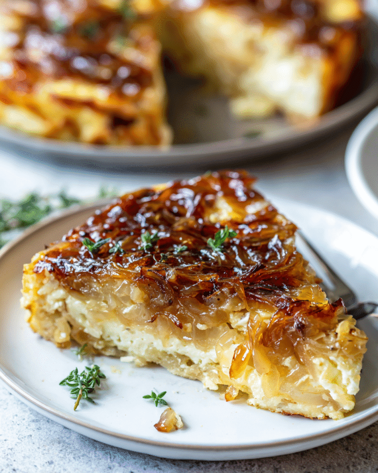 Slice of Onion and Gruyère Cottage Cheese Bake on a plate