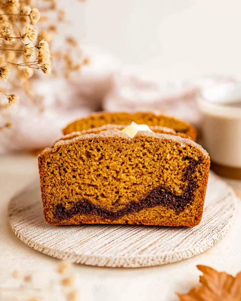 Snickerdoodle pumpkin bread slice served with butter and coffee