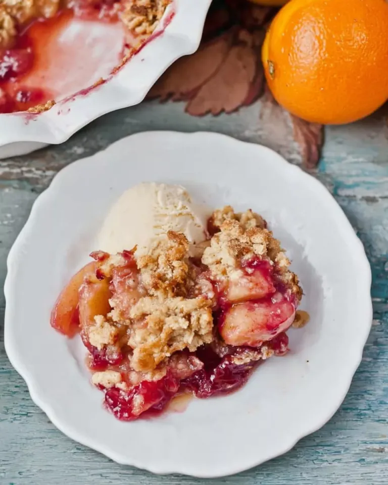 Serving of cranberry apple cottage cheese bake with ice cream